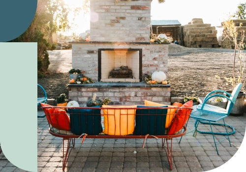 An outdoor patio with a fireplace